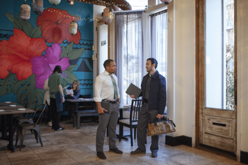 Provider speaking to restaurant owner about asset management.