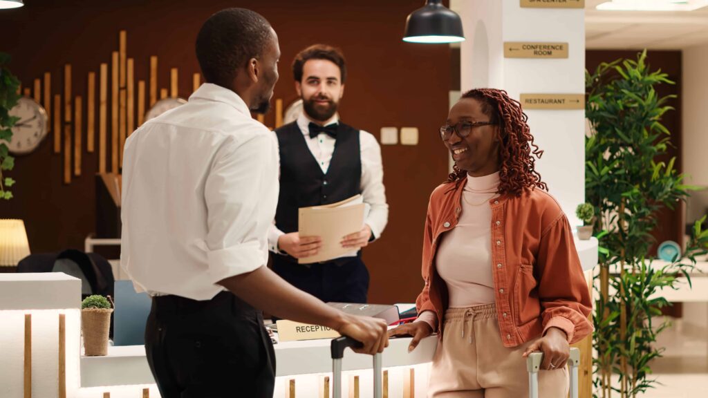 Couple checking out from luxury hotel