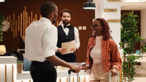 Couple checking out from luxury hotel